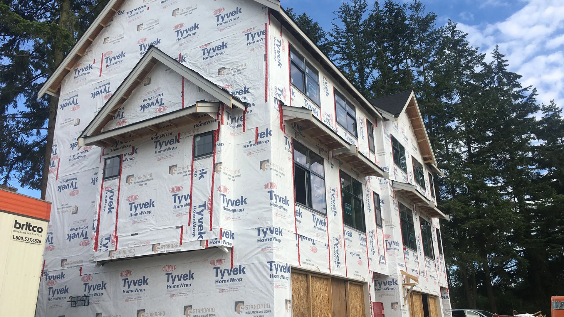 Tyvek HomeWrap covering a multi-storey residential exterior around window openings